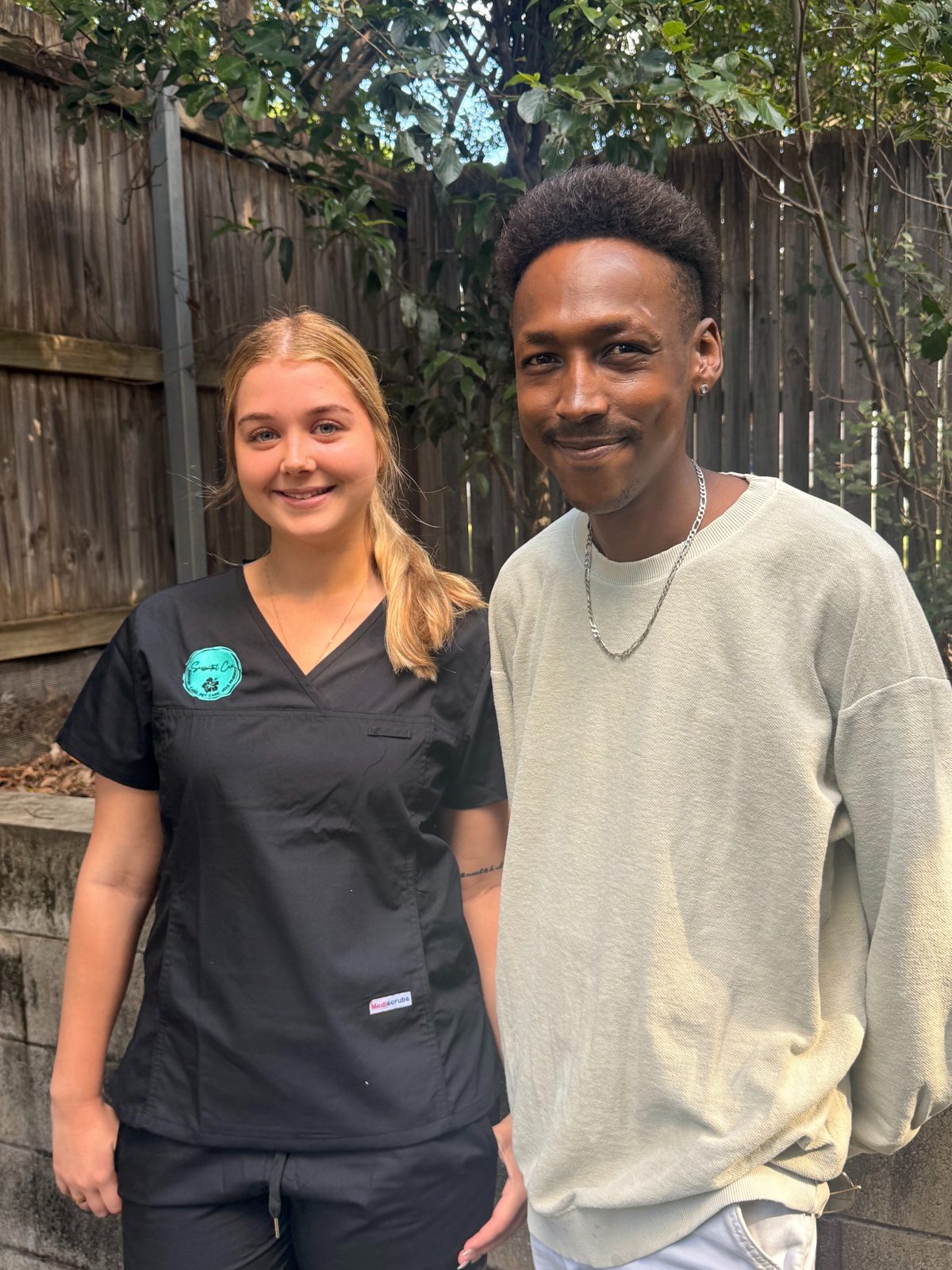 A Sassential Care carer in uniform with a client