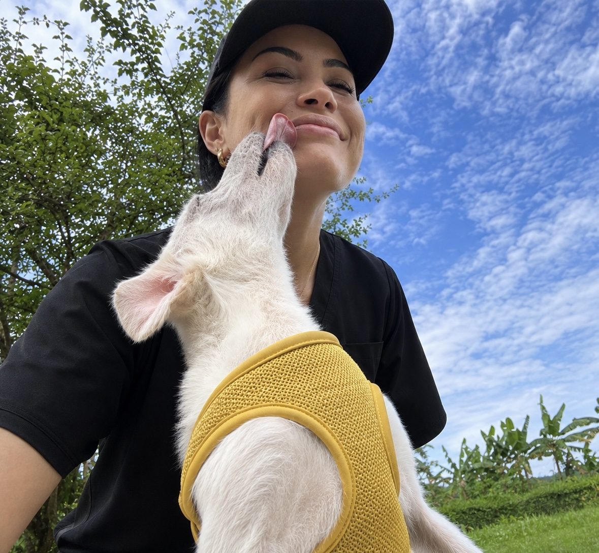 Sass with a client’s dog during a home visit